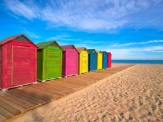 Colorful huts on the beach of San Juan de Alicante
